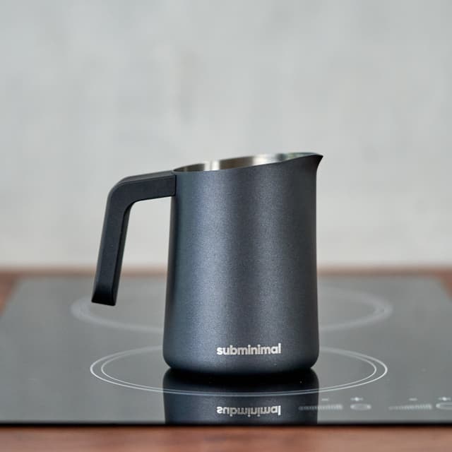 Subminimal FlowTip Milk Jug (450ml/15oz) - Advanced Design Milk Jug w/ Ergonomic & Heat Resistant Handle, StoveTop Compatible, Stainless Steel, Smooth Neck & Sharp Tip - Black