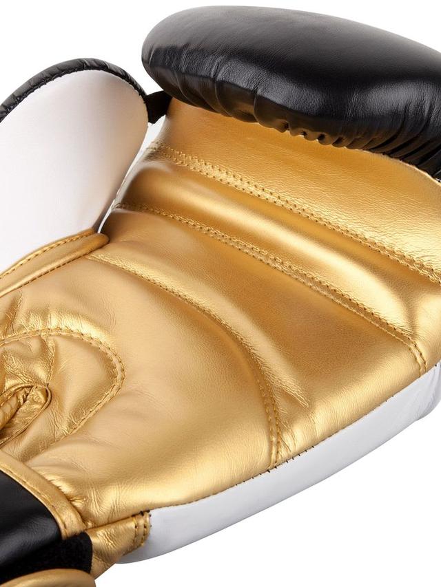 قفازات ملاكمة جلد صناعي 10 أونصة أسود وأبيض وذهبي فينوم Venum Contender 2.0 Boxing Glove - SW1hZ2U6MTU0NTkyMw==