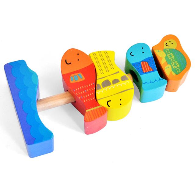 لعبة اطفال تعليمية تكديس الأسماك خشب لعمر 12 شهر كول توي A Cool Toy Wooden Fish Stacking Toy - SW1hZ2U6MjAyNzQ4OA==