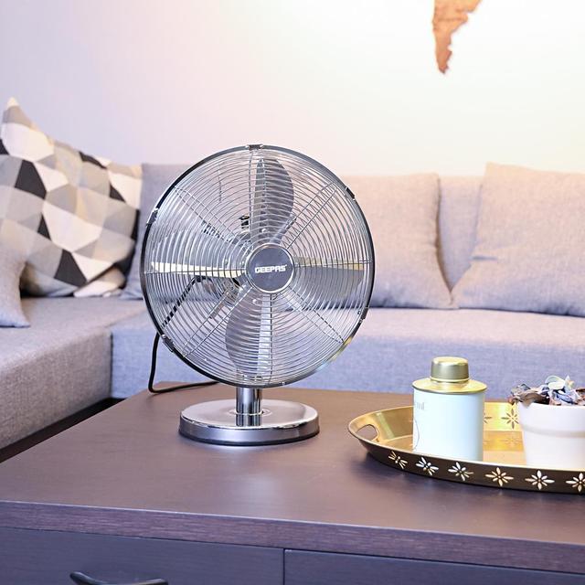 Geepas 12-Inch Metal Table Fan 3 Speed Settings With Wide Oscillation With Stable Base Ideal For Desk Fan, Home Or Office Use 2 Year Warranty - SW1hZ2U6MTM3NjA4