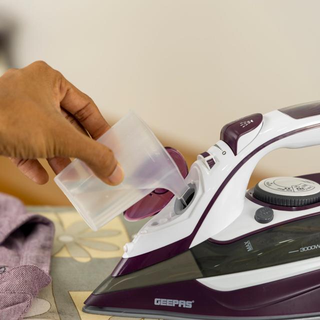 Geepas Ceramic Steam Iron, Temperature Control, GSI24025 - Ceramic Sole Plate, Wet and Dry, Self-Cleaning Function, 3000W, Powerful Steam Burst, 400ml Water Tank, 2 Years Warranty - SW1hZ2U6NDUxMjQy